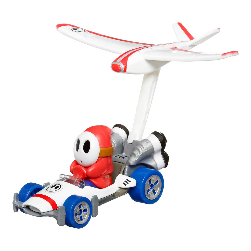 Hot Wheels Mario Kart Vehículo de Juguete Shy Guy B Dasher con Plane Glider